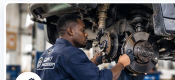 Technician performing vehicle repair and maintenance